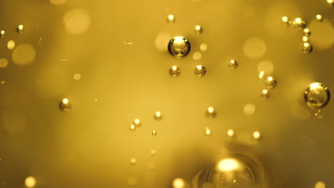 Abstract-science-or-art-background-with-gold-bubbles-rising
