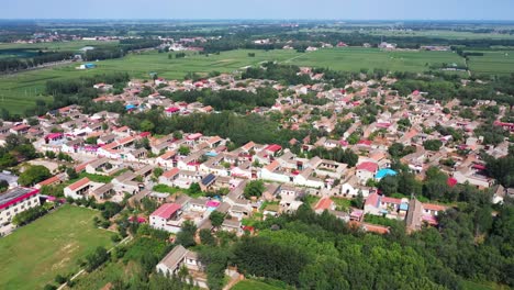 Sunny-aerial-drone-shot-of-a-small-village-in-the-rural-Hebei-province-of-China