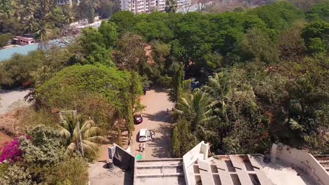 Aerial-Shot-of-People-Passing-through-a-Zoo-or-National-Park-Entrance,-Sanjay-Gandhi-National-Park,-India