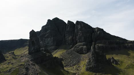 Aerial-view-pulling-away-from-Scotland's-Old-Man-of-Storr-with-overcast-skies