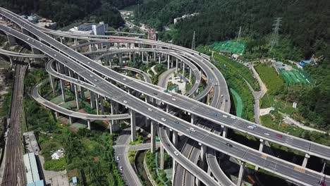 Daytime-highway-aerial-of-a-big-interchange-bridge-of-Chongqing,-Huangjuewan,-China