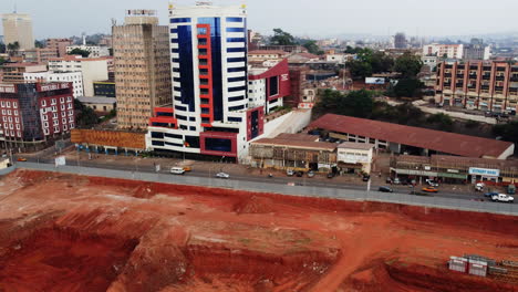 Aerial-view-of-a-construction-site-in-front-of-the-General-Delegation-Of-Taxes,-in-Yaounde,-Cameroon