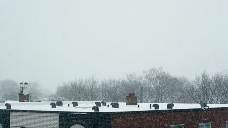 Urban-Building-Roof-with-Chimneys-and-Satellite-Dish-Covered-in-Snow-4K