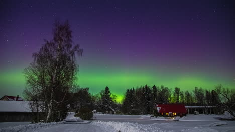 Time-lapse-shot-of-beautiful-colors-illuminating-sky-with-stars-at-night-during-aurora-borealis-outdoors-in-snow-landscape