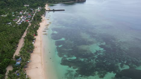 Establishing-Aerial-Shot-of-Idyllic-Tropical-Beach,-Reef-and-Bangka-Boats,-Cataduanes,-Philippines