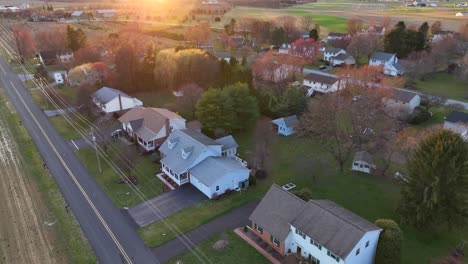 Aerial-tilt-up-reveal-of-sunset-over-American-houses