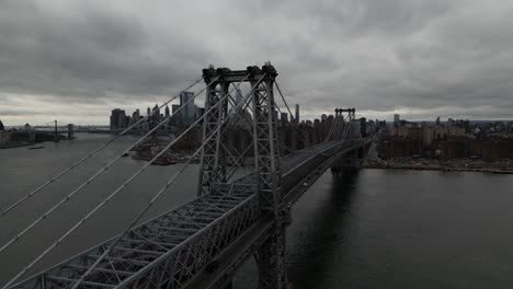 A-high-angle-aerial-view-of-Lower-Manhattan-from-over-the-northside-of-the-Williamsburg-Bridge-in-NY-on-a-cloudy-day