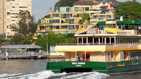 A-Sydney-ferry-moves-through-frame-and-pulls-into-McMahons-Point-in-Australia