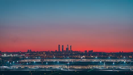 Timelapse-Madrid-skyline-towers-and-Barajas-airport-silhouete-during-colorful-sunset