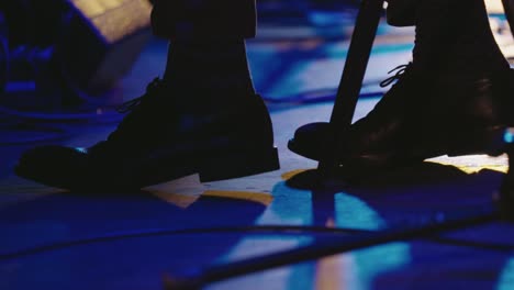 Musician-keeps-the-beat-with-high-heels-on-stage