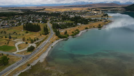 Lake-Tekapo-and-small-town-in-New-Zealand,-aerial-drone-view