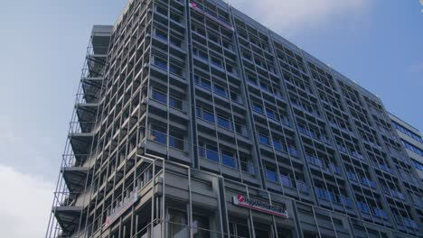 Corporate-Building-and-Statue-Upwards-Panning-Shot-Schlossplatz-In-Downtown-Stuttgart-in-4K,-Red-Komodo-Cooke-Mini-S4i-Lens-Premium-Quality-|-News