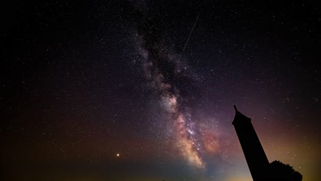 Nightsky-Timelapse,-moving-milky-way,-tower-foreground