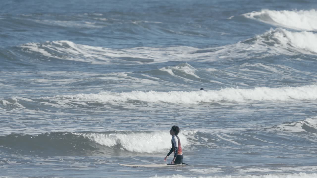 Beginner Surfer Trying To Surf In Shallow Water, Walking Against Small ...