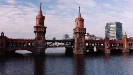 Oberbaum-Bridge--crossing-Berlin's-River-Spree,-Germany;-aerial