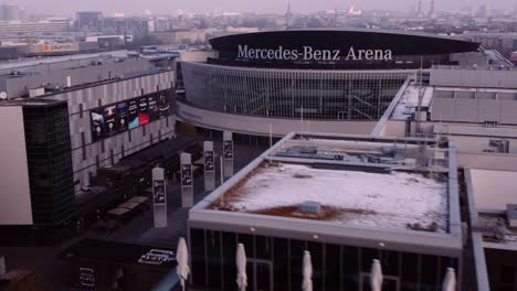Rooftop-aerial-reveals-exterior-of-iconic-Mercedes-Benz-Arena,-Berlin,-Germany