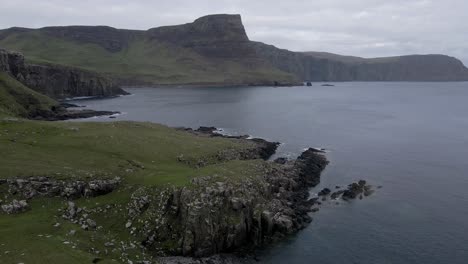 4k-aerial-drone-footage-zooming-in-on-rocky-coastline-at-neist-point-in-scottish-highlands-scotland-uk