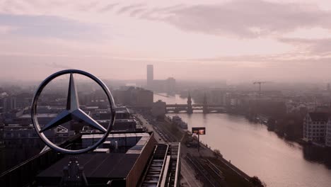 Drone-view-of-Oberbaum-bridge-from-Mercedes-Benz-headquarters-rooftop,-Berlin