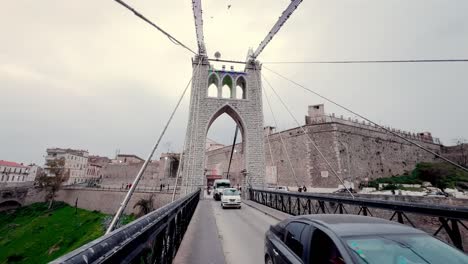 Stock-footage-of-the-amazing-atmosphere-over-the-city's-famous-suspension-bridges,-including-the-impressive-Sidi-M'Cid-Bridge
