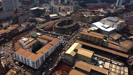 Drone-shot-towards-the-old-semicircular-Market-Hall,-in-sunny-Yaounde,-Cameroon