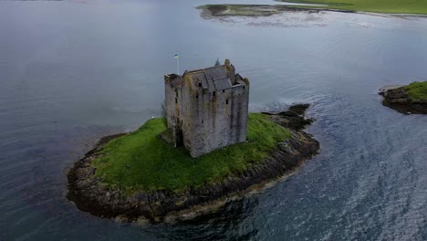 close-up-4k-aerial-drone-footage-of-castle-on-island-surrounded-by-water-in-highlands-of-scotland-uk