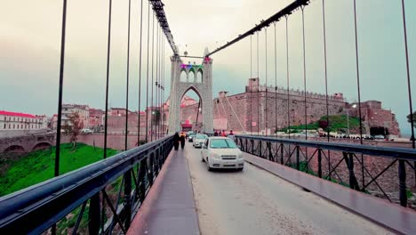 Footage-of-the-beautiful-atmosphere-over-the-city's-famous-suspension-bridges,-including-the-impressive-Sidi-M'Cid-Bridge