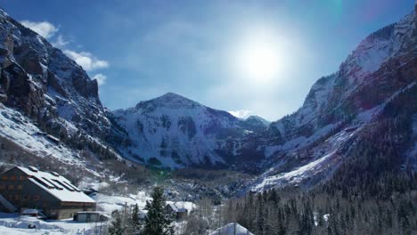 Drone-view-of-Black-Bear-Pass-Steps-in-Telluride,-Colorado-looking-into-the-sun