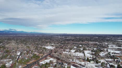 Distant-drone-aerial-view-of-Denver,-Colorado-skyline-on-a-sunny-day