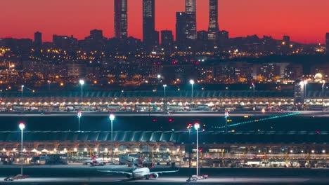 Timelapse-Madrid-skyline-towers-and-Barajas-airport-silhouete-during-colorful-sunset-close-up-zoom-shot