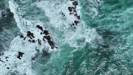 Top-down-drone-shot-off-Corny-Point's-rocky-beach-shores