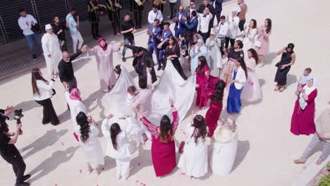 Rotation-Aerial-View-of-a-Family-Dancing-Out-of-Montpellier-City-Hall-for-a-Wedding