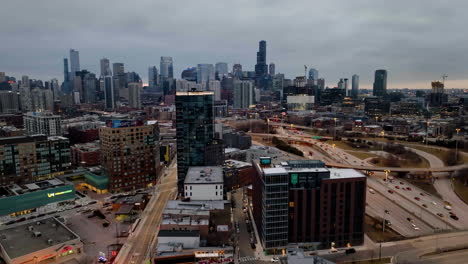 Aerial-tracking-view-of-the-cityscape-of-River-West,-dramatic-evening-in-Chicago