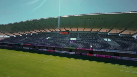 FPV-aerial-view-above-the-empty's-football-stadium-in-Montpellier,-France