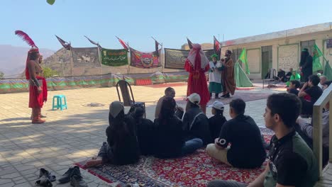 Local-Persian-Iranian-people-are-watching-Tazieh-the-religion-ritual-performance-art-musical-dramatic-show-of-tragedy-in-Muharram-for-Shia-Muslim-artists-wear-costumes-to-simulate-the-historical-war