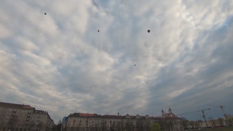 Timelapse-of-Hot-Air-Ballooning-Over-Vilnius,-Lithuania