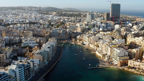Panoramic-Aerial-View-Of-Cityscape-On-Malta-Spinola-Bay