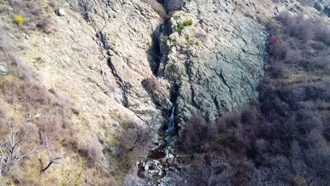 Aerial-footage-of-a-waterfall-in-the-Balkan-mountains-near-the-town-of-Sopot,-Bulgaria