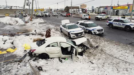 Accident-after-a-white-sedan-motor-vehicle-has-crashed-into-an-electricity-utility-pole,-Brampton,-Canada