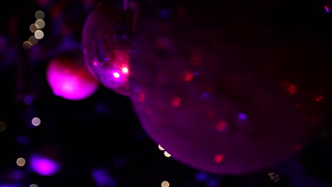 Christmas-tree-balls-with-purple-lights---close-up