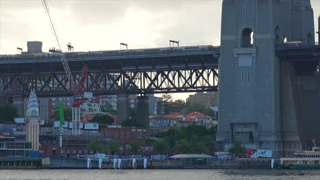 Two-trains-pass-each-other-on-Sydney-Harbour-bridge,-Australia