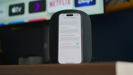 smartphone-connected-to-a-HomePod,-a-smart-speaker-developed-by-Apple
