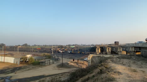 Pan-shot-of-rail-track,-traffic-on-road