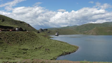 Highway-traffic-drives-along-Katse-Lake-intake-tower-in-Lesotho-Africa