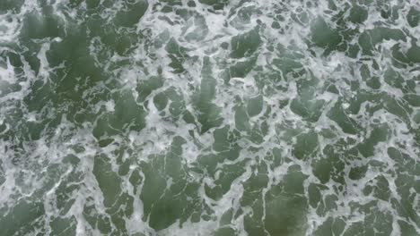 Waves-crashing-into-shallow-water-from-above
