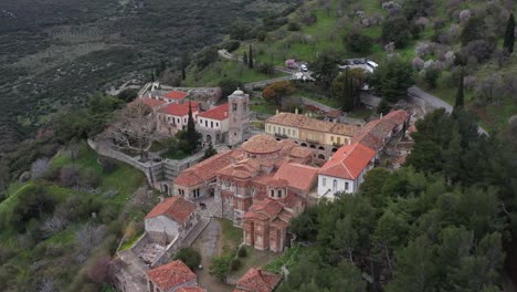 A-cinematic-fly-away-tilt-reveal-shot-of-Hosios-Loukas-holy-monastery