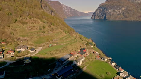 Establishing-small-fisher-village-in-Norway,-aerial-dolly-backward-flight