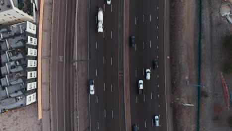 Top-Down-Shot-of-Cars-Driving-Down-Interstate-in-Denver,-Colorado
