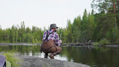 Fly-fisherman-fishing-in-a-stream-in-slowmotion