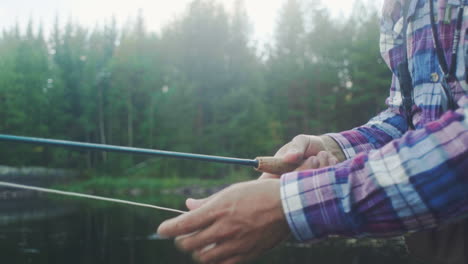 Fly-fisherman-casting-with-a-fly-rod-in-slowmotion