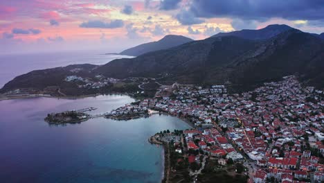Cinematic-aerial-footage-of-seaside-town-at-evening-dawn-after-colourful-sunset-in-Turkey